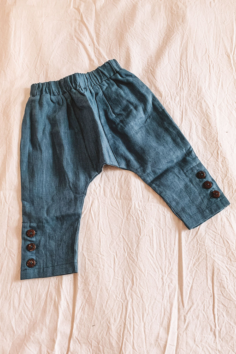 Kids bohemian style linen pants featuring coconut button detail. Exclusive to We the Wild Collective