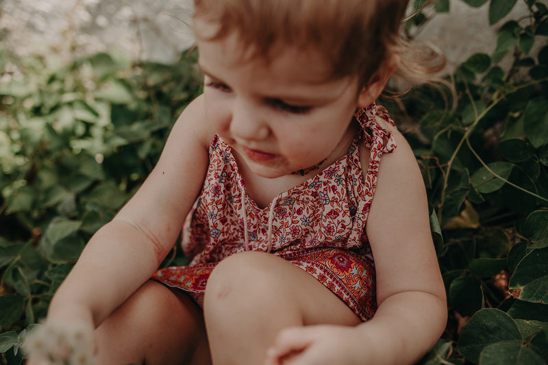 Kids Bohemian inspired, floral printed dress. Adjustable straps, border print and cotton neck tassels. Border floral print in multi colour